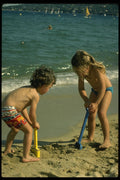 544037 Digging At The Beach A4 Photo Print