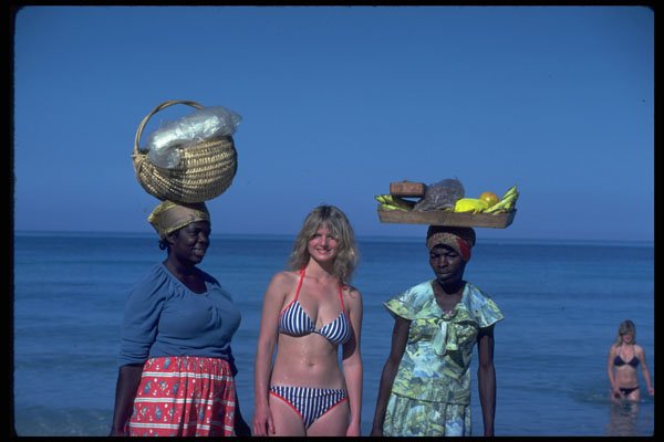 544060 Girl Poses With Natives On Beach In Jamaica A4 Photo Print