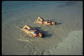 544061 Reclining Girls On Beach In Jamaica A4 Photo Print