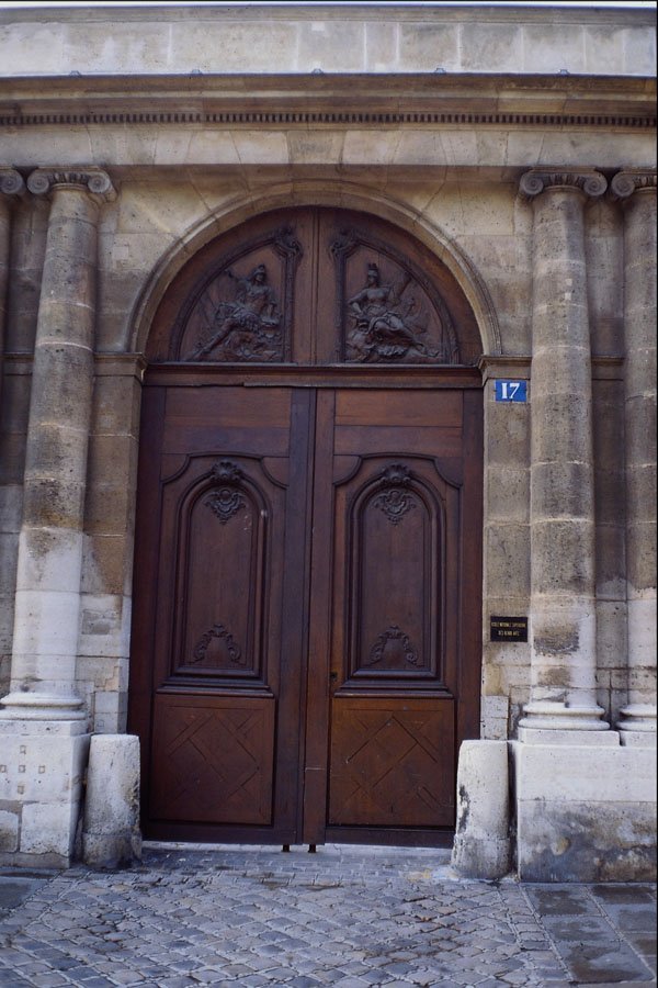 549027 Brown Door With Two Allegorical Figures A4 Photo Print