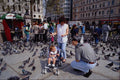 551078 Tourists Feeding Pigeons, Trafalgar Square, London, England A4 Photo Print