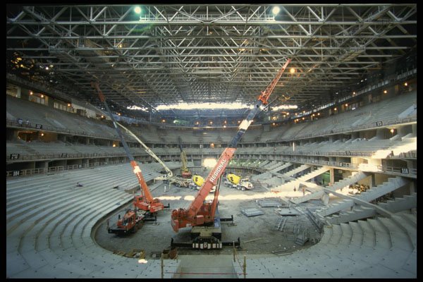560033 Installing Lower Bowl Of Stadium A4 Photo Print
