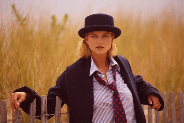 561084 Carrie Leaning On A Beach Fence, Wearing Bowler Hat A4 Photo Print