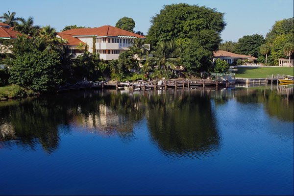 562056 Tranquil Village Of Coconut Grove A4 Photo Print