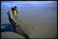 567043 Clearing Mud From Shrimp Nets, Southport Sands, Australia A4 Photo Print