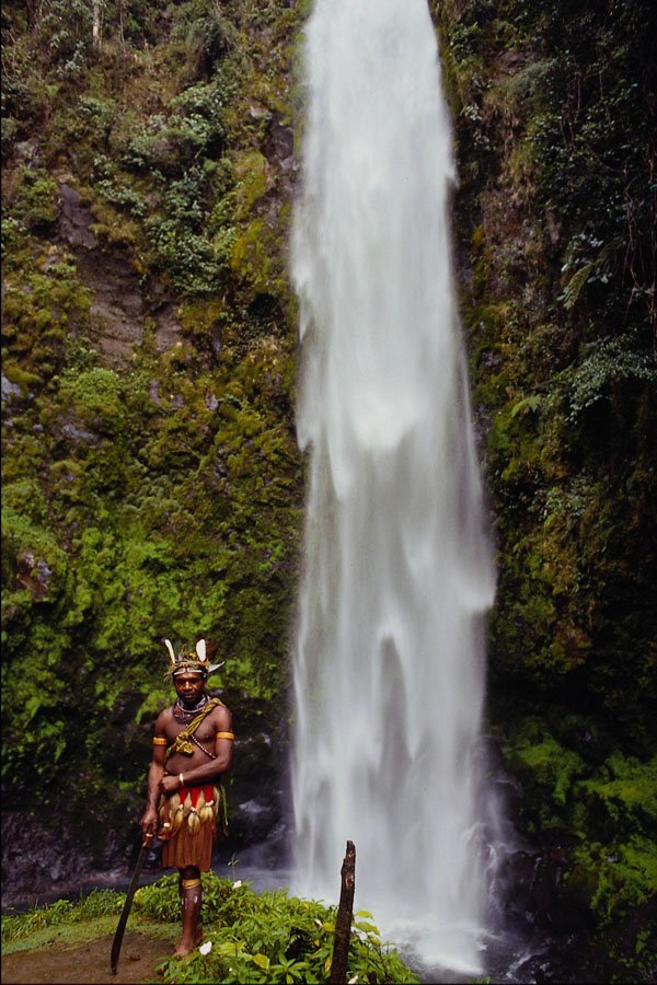 567073 The Huli Wigman Poses By A Waterfall, New Guinea A4 Photo Print