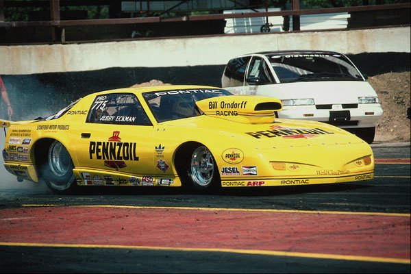 573000 A Canary yellow Firebird Spins Its Tires To Heat Them Up A4 Photo Print