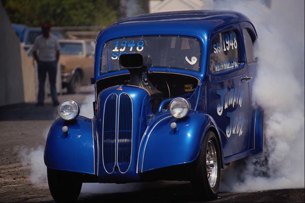 573067 An Old fashioned Hot Rod Tries To Hide In Its Own Smoke A4 Photo Print