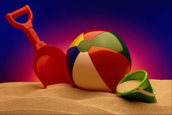 577094 Beach Ball, Bucket And Shovel In Sand A4 Photo Print