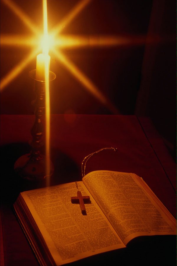 577095 Bible And Crucifix Lit By Candlelight A4 Photo Print