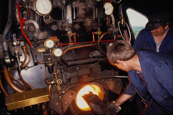 578061 Watercress Line Steam Railway, Fireman Stoking The Fire A4 Photo Print