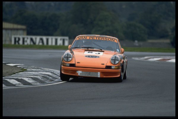 582070 Mustard colored Porsche 911 On Racetrack A4 Photo Print
