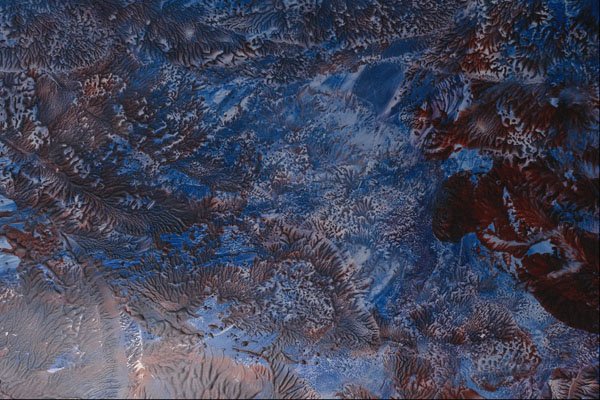583034 Melting Brown On Blue A4 Photo Print