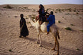 585090 Tuareg Leads His Camel With Wife And Child, Sahara, Mali A4 Photo Print