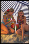 592004 Girls Under Beach Umbrella A4 Photo Print