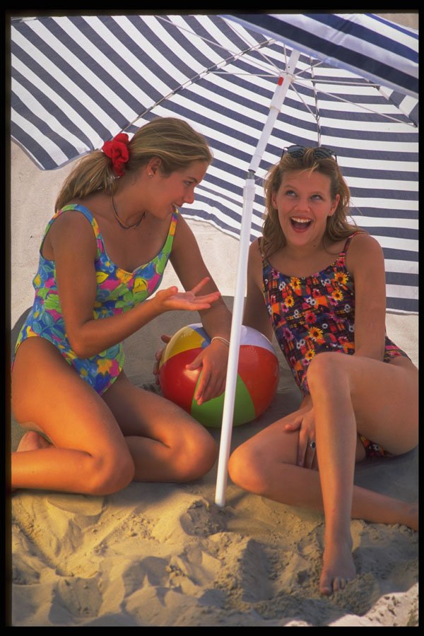592004 Girls Under Beach Umbrella A4 Photo Print
