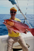 592070 Fisherman With Red Snapper A4 Photo Print