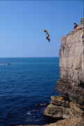 592080 Boy Jumping Into Sea From Pulpit Rock, Dorset, England A4 Photo Print