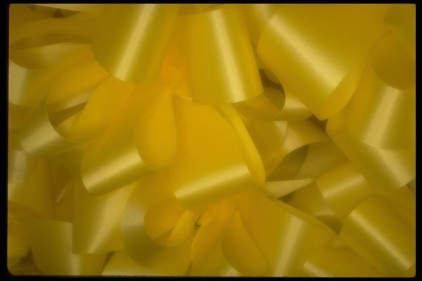 593001 Texture Of Many Lemon yellow Ribbons And Bows A4 Photo Print