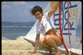 596005 Woman Squatting On Beach, St. Tropez A4 Photo Print