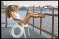596032 Beth In A One piece Suit Seated Overlooking The River A4 Photo Print