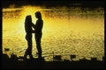 598012 Couple By Lake At Sunset A4 Photo Print