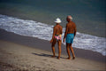 598060 Senior Beach Walkers A4 Photo Print