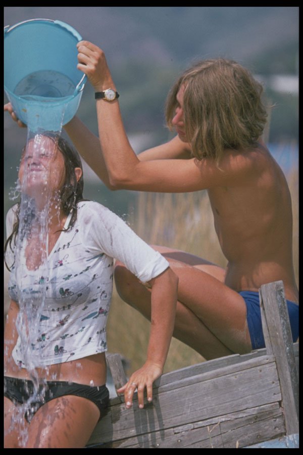 598066 Sprinkling Water Over Her Head A4 Photo Print