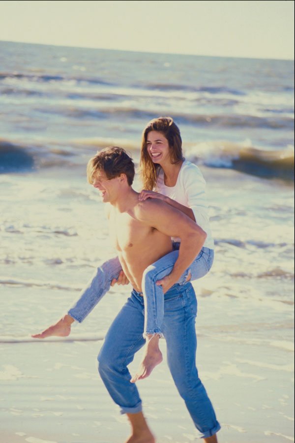 598073 Playful Couple At The Beach A4 Photo Print