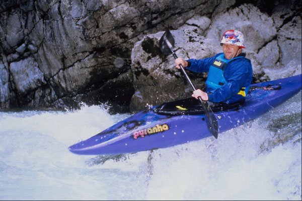 599078 Canoeist Chris Taudevin Jumps A Rock A4 Photo Print