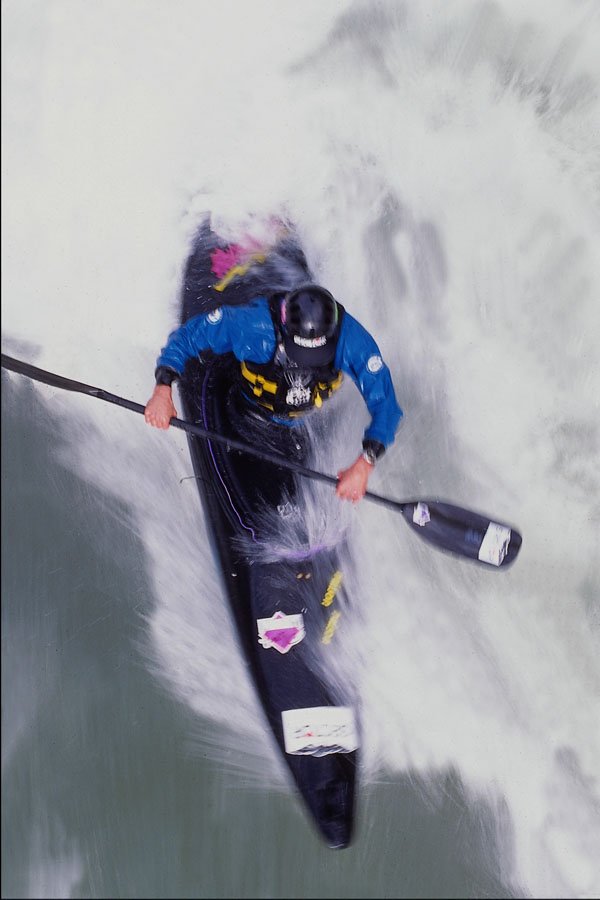 599079 Canoeist Shaun Baker Surfs A River Wave A4 Photo Print