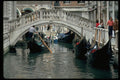 606016 Gondolas With Tourists Going Under Bridge, Venice, Italy A4 Photo Print