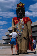 609076 A Giant Puppet Offers Amusement On The Museum Plaza A4 Photo Print
