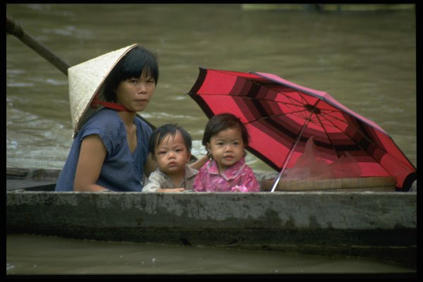 621076 Mother And Children On Boat A4 Photo Print