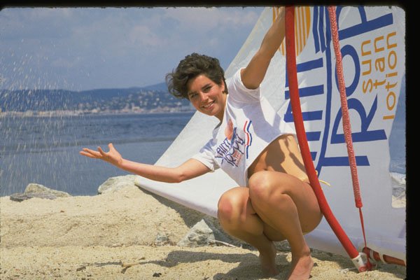 626011 Woman Crouching, Hand Out, St. Tropez A4 Photo Print