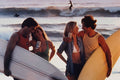 628094 Surfer Couples On The Beach A4 Photo Print