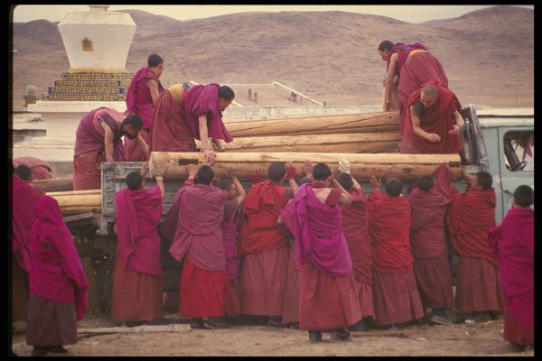 630038 Monks Loading Logs In A Truck A4 Photo Print