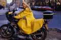 631084 Woman In A Bright yellow Raincoat On Her Motorcycle A4 Photo Print