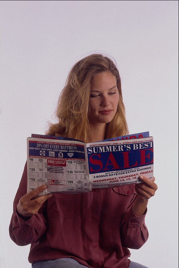 635033 Woman Reading A Catalog A4 Photo Print