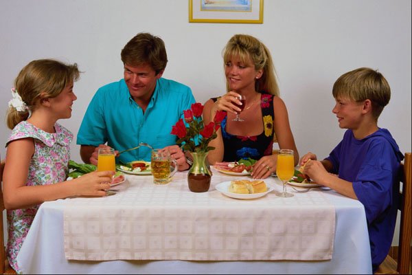 635068 Family Having A Meal At Home A4 Photo Print