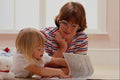 635089 Mother Teaching Young Girl To Read A4 Photo Print