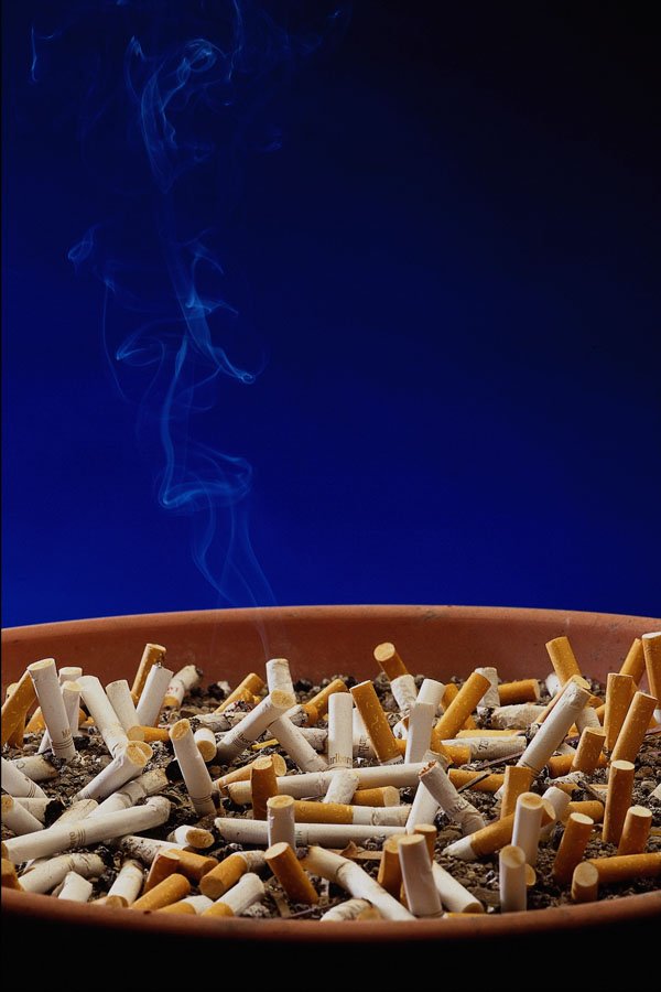 643049 Ashtray With Smoldering Butts A4 Photo Print