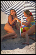 647036 Girls Under Beach Umbrella A4 Photo Print