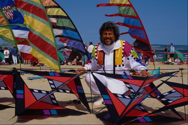 647062 Kite Maker On Beach A4 Photo Print