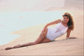 647077 Lady In White Swimsuit On Beach Shore A4 Photo Print