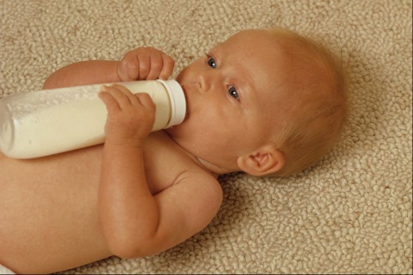 651001 Young Baby With Bottle A4 Photo Print