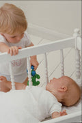 651029 Little Boy With Baby In Crib A4 Photo Print
