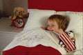 651072 Boy In Bed With Soft Toy A4 Photo Print