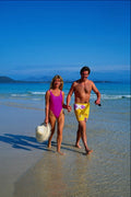654048 Couple Walking Along Beach, Playa Blanca, Spain A4 Photo Print