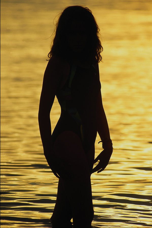 654075 Silhouette Of Girl In Water A4 Photo Print